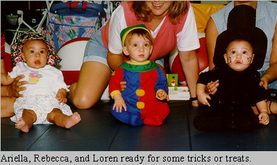 Ariella, Rebecca, and Loren go trick or treating.